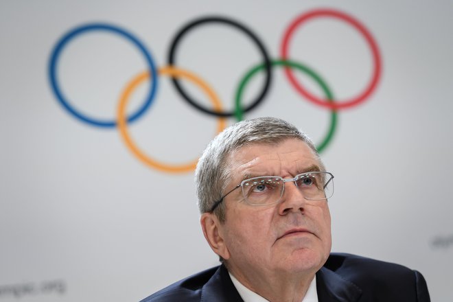 Thomas Bach se sooča z obtožbami na račun prirediteljev naslednjih zimskih olimpijskih iger. FOTO: Fabrice Coffrini/AFP