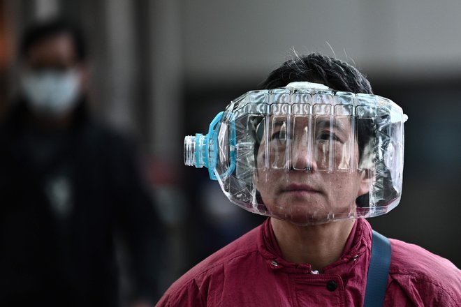 Kitajska ne preneha iskati držav, ki bi lahko bile poleg nje vir novega koronavirusa. FOTO: Anthony Wallace/AFP