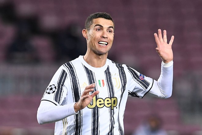 Cristiano Ronaldo je bil proti Barceloni dvakrat natančen z bele točke. FOTO: Josep Lago/AFP