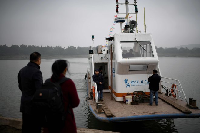 Zaradi nakupa plovila in preureditve hiše za turiste ima Yang Zeqiang več kot 12.500 evrov dolga. FOTO: Noel Celis/AFP