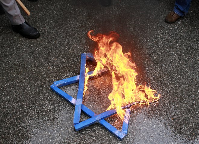 Danes se svet spominja orgaziranega nacističnega poboja Judov. FOTO: Umit Bektas/Reuters