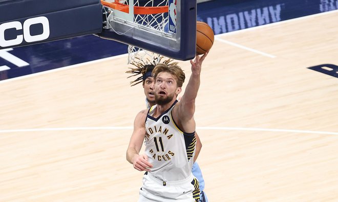 Tudi sloviti oče Arvidas Sabonis je ponosen na to, v kako odličnega igralca se razvija sin Domantas Sabonis. FOTO: Andy Lyons/AFP