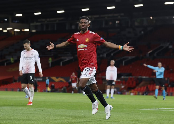 Amad Diallo se je takole veselil gola za Manchester United. FOTO: Phil Noble/Reuters