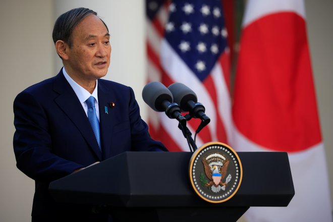 Japonski premier Jošihide Suga je zatrdil, da olimpijske igre v Tokiu ne bodo odpovedali. FOTO: Tom Brenner Reuters