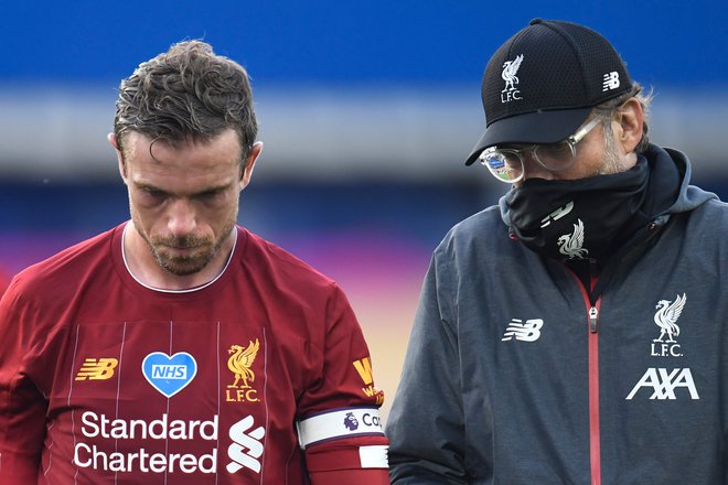 Nočeta je in je tudi ne marata: Liverpoolova kapetan in trener Jordan Henderson in Jürgen Klopp sta proti superligi. FOTO: Peter Powell/AFP