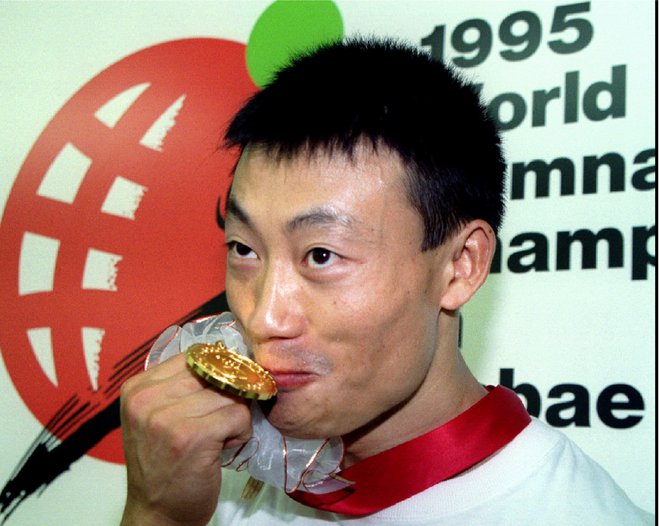 Donghua Li se spogleduje z nastopom na olimpijskih igrah leta 2024 v Parizu. Takrat bo star 56 let. FOTO: Reuters