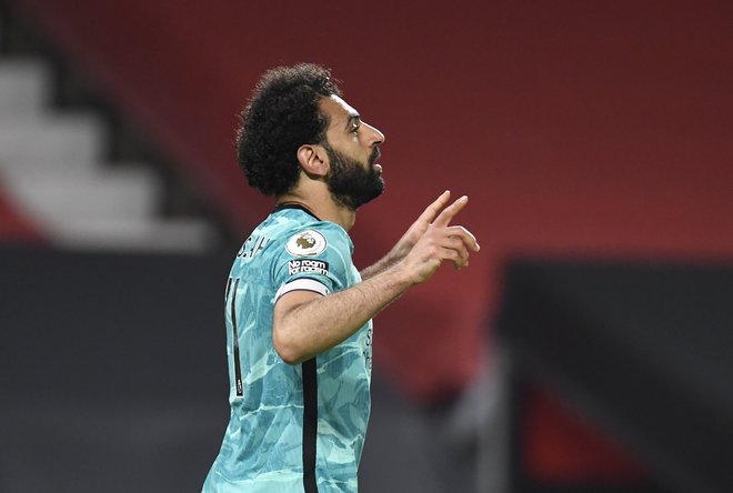 Najboljši strelec Liverpoola Mohamed Salah moli za sanjski razplet sezone. FOTO: Peter Powell/Reuters