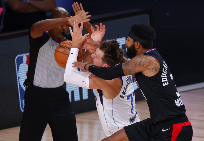 Luka Dončić in Marcus Morris bosta spet tekmeca v prvem krogu končnice. FOTO:&nbsp;Kevin C. Cox/AFP