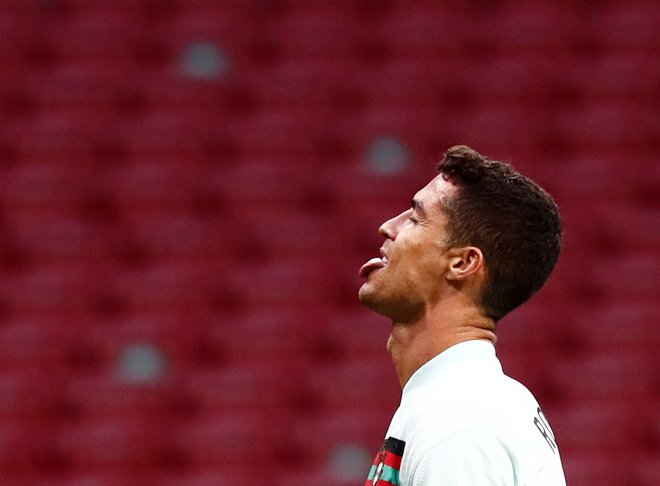 Portugalska je s Cristianom Ronaldom nazadnje brez golov remizirala s Španijo v Madridu. FOTO: Sergio Perez/Reuters
