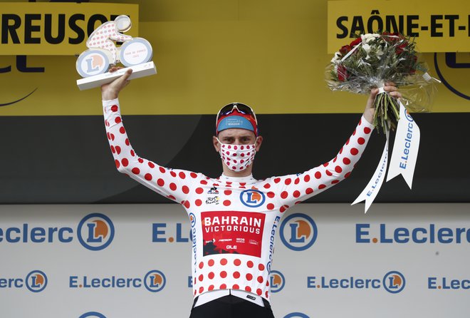 Matej Mohorič bo odslej kolesaril v pikčasti majici. FOTO: Benoit Tessier/Reuters