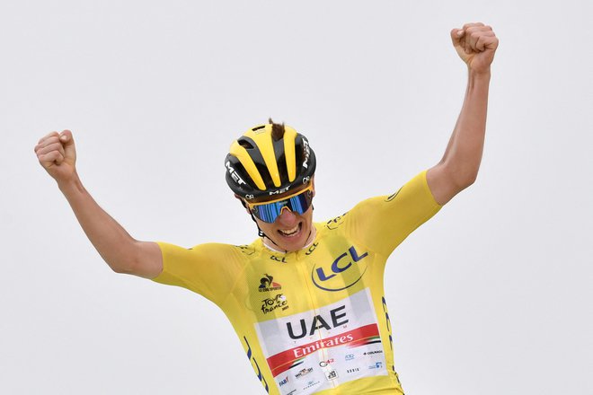 V nedeljo bo Tadej Pogačar postal prvi kolesar v zgodovini z dvema zmagama pred dopolnjenim 23. letom. FOTO: Philippe Lopez/AFP