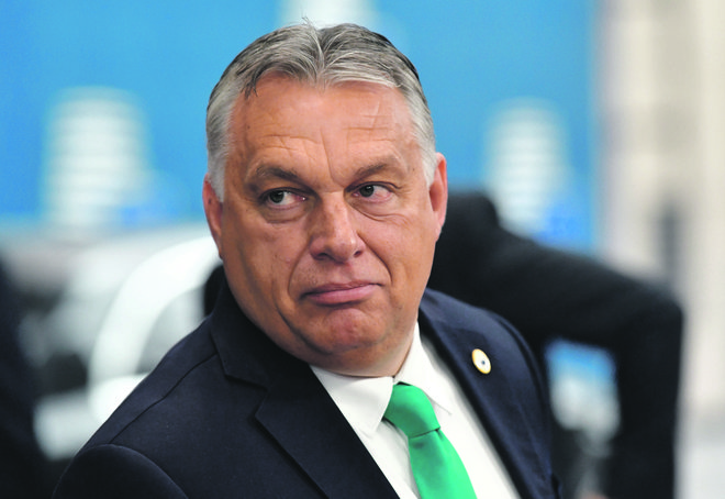 V vladi <strong>Viktorja Orbána </strong>vztrajajo, da o spornem programu ne vedo nič. FOTO: John Thys/Reuters