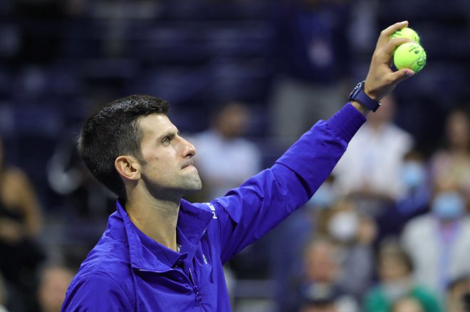 Novak Đoković lahko v nedeljo osvoji rekordni 21. turnir za grand slam. FOTO: Kena Betancur/AFP