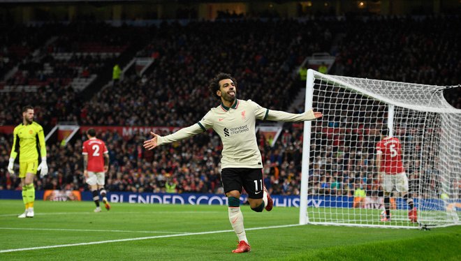 Mohamed Salah je na Old Traffordu zablestel s kar tremi zadetki. FOTO: Oli Scarff/AFP
