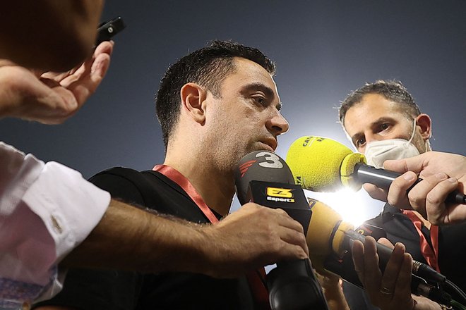 Xavi (na fotografiji) je igralsko kariero končal v Dohi in tam tudi začel svojo trenersko pot. FOTO: Karim Jaafar/AFP
