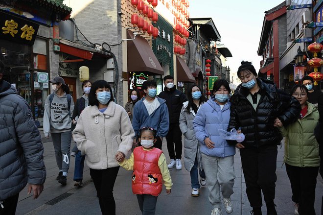 Ljudje na ulicah Pekinga 13. novembra. Foto Jade Gao Afp
