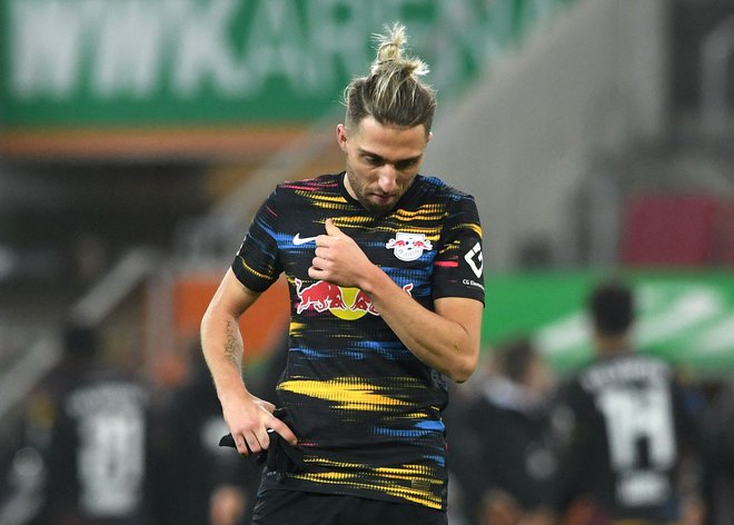 Kevin Kampl je tudi v tej sezoni praktično nezamenljiv člen rdečih bikov iz Leipziga. FOTO: Christof Stache/AFP
