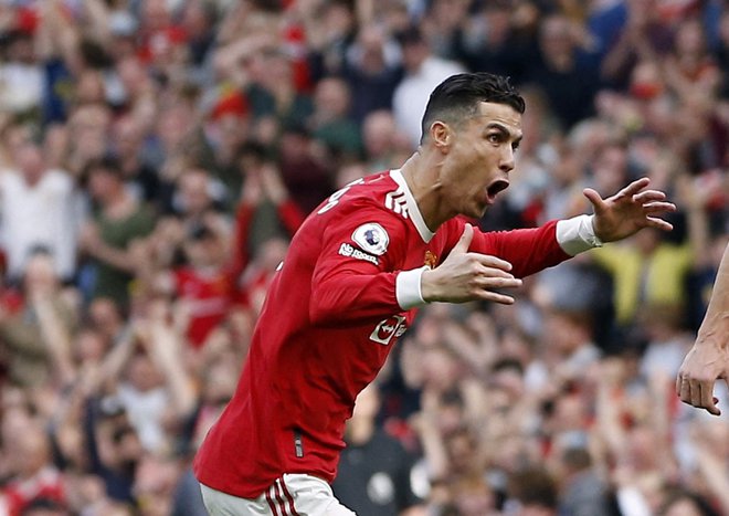 Cristiano Ronaldo je rešil ManU proti zadnjemu Norwichu, tako se je veselil odločilnega, svojega tretjega zadetka. FOTO: Craig Brough/Reuters
