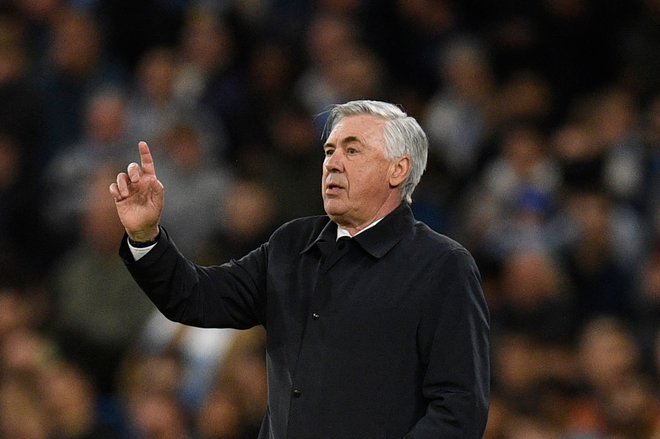 Realov strateg Carlo Ancelotti je pred zgodovinskim podvigom. FOTO: Oli Scarff/AFP
