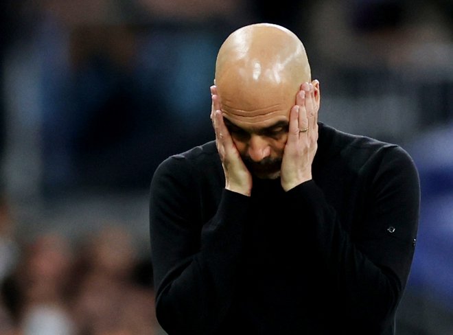 Pep Guardiola ni skrival razočaranju po še enem neuspešnem naskoku na ligo prvakov z Macnehster Cityjem. FOTO: Carl Recine /Reuters
