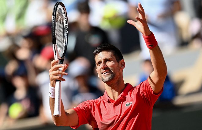 Novak Đoković (na fotografiji) proslavlja zmago proti Aljažu Bedenetu. FOTO: Christophe Archambault/AFP
