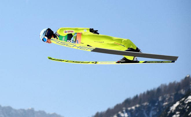 Kamil Stoch na marčevski tekmi v Planici. FOTO: Borut Živulović/Reuters
