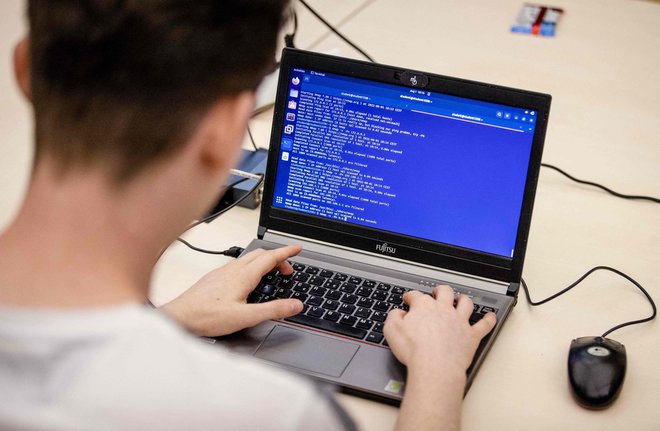 Digitalizacija s seboj prinaša potrebo po kibernetski zaščiti. FOTO: Sem Van Der Wal/AFP
