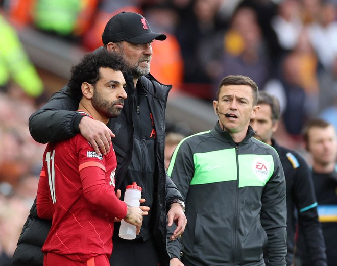 Mohamed Salah in trener Jürgen Klopp merita visoko tudi v tej sezoni. FOTO: Phil Noble/Reuters
