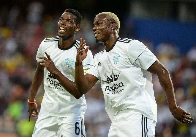 Mathias Pogba (desno) in slavnejši brat Paul Pogba sta v sporu, ki buri duhove. FOTO: Joaquin Sarmiento/AFP
