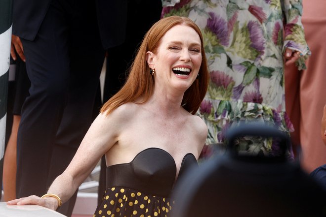 Ameriška igralka Julianne Moore je predsednica letošnje žirije, ki bo ob zaključku festivala podelila zlate leve. Foto Guglielmo Mangiapane/Reuters
