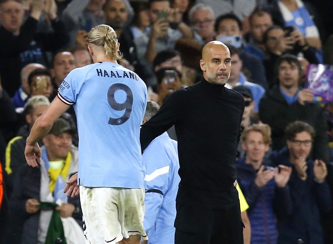 Pep Guardiola uživa v golih svojega najdragocenejšega igralca Erlinga Haalanda. FOTO: Craig Brough/Reuters
