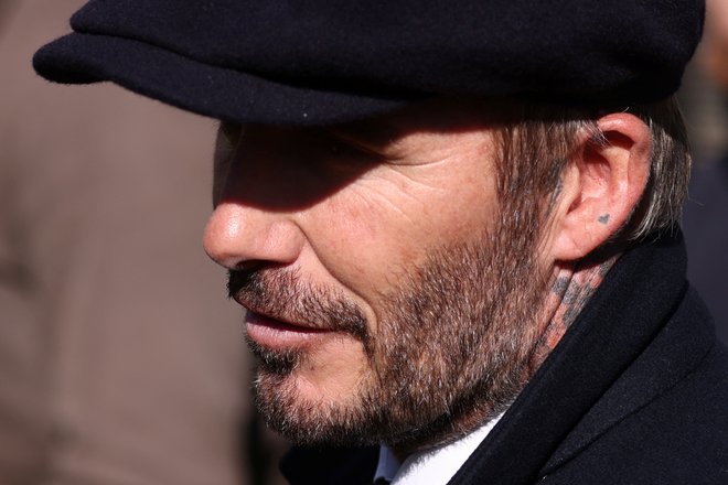 David Beckham je bil odlikovan za zasluge angleškemu športu. FOTO: Tom Nicholson/Reuters
