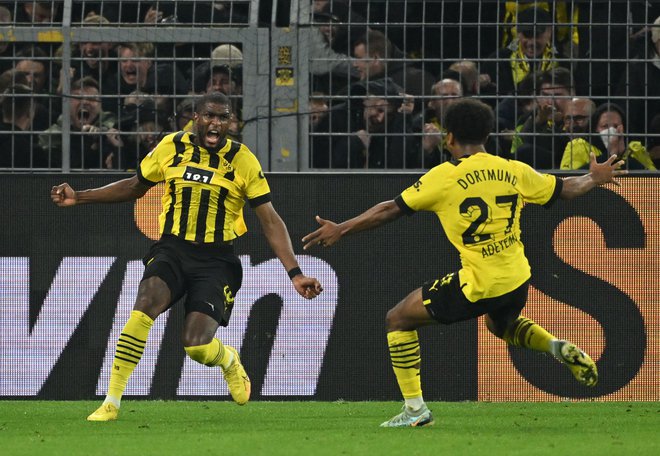 Anthony Modeste (levo) se je izjemno razveselil svojega gola za izenačenje v velikem derbiju bundeslige. FOTO: Ina Fassbender/AFP
