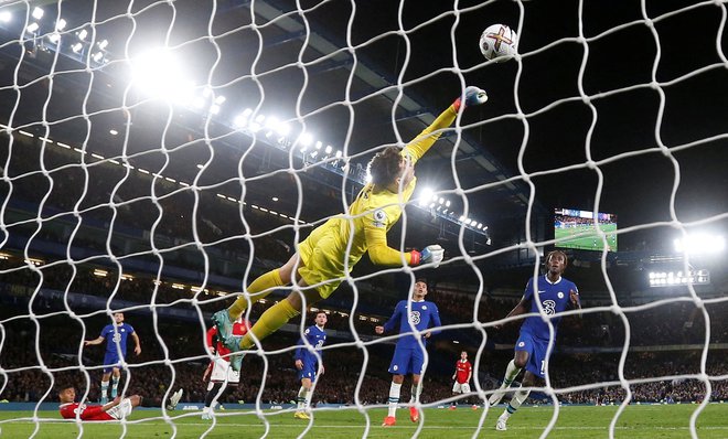 Casemiro (levo na tleh) je prinesel točko Manchester Unitedu. FOTO: Matthew Childs/Reuters
