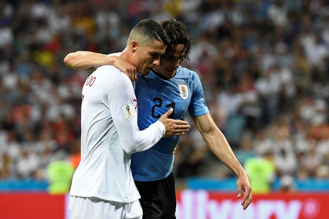 Cristiano Ronaldo in Edinson Cavani (oba na fotografiji) sta si nekaj časa delila slačilnico pri Manchester Unitedu. FOTO: Jonathan Nackstrand/AFP
