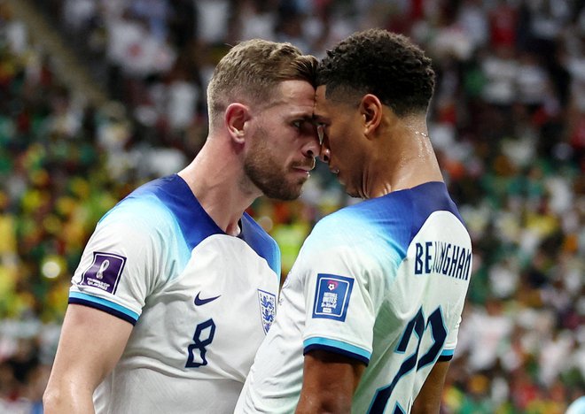 Jordan Henderson in Jude Bellingham sta bila tvorca prvega gola za Angleže. FOTO: Marko Djurica/Reuters
