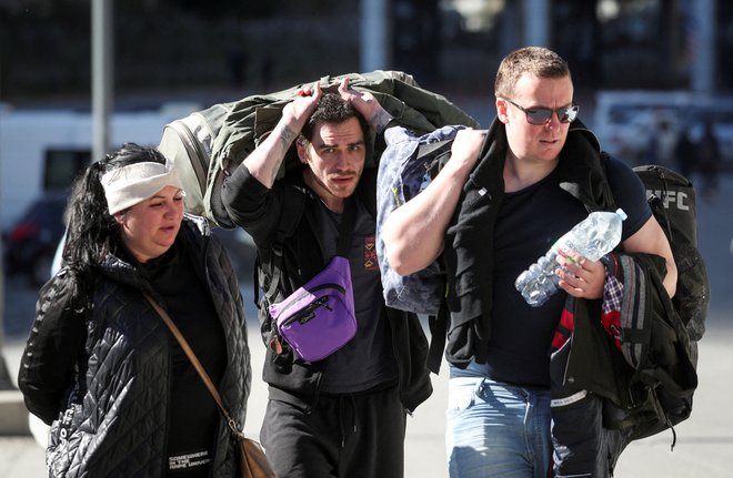 Po septembrski delni mobilizaciji rezervistov so številni Rusi odšli v sosednje države. FOTO: Irakli Gedenidze/Reuters
