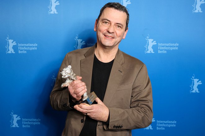 Nemški režiser Christian Petzold je za film Rdeče nebo prejel nagrado žirije. FOTO: Jorg Carstensen/Reuters
