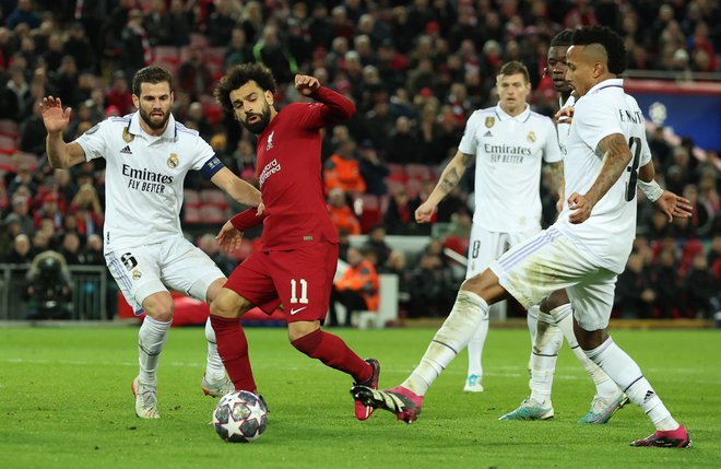 Mohamed Salah (drugi z leve) je po porazu z Realom dosegel tri gole na ravno toliko tekmah in proti ManUnitedu postal najboljši strelec Liverpoola v zgodovini premier league (129). FOTO: Phil Noble/Reuters
