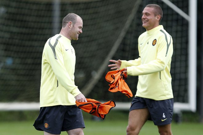 Wayne Rooney in Nemanja Vidić s skupnega treninga Manchester Uniteda leta 2010.&nbsp;FOTO: Phil Noble/Reuters
