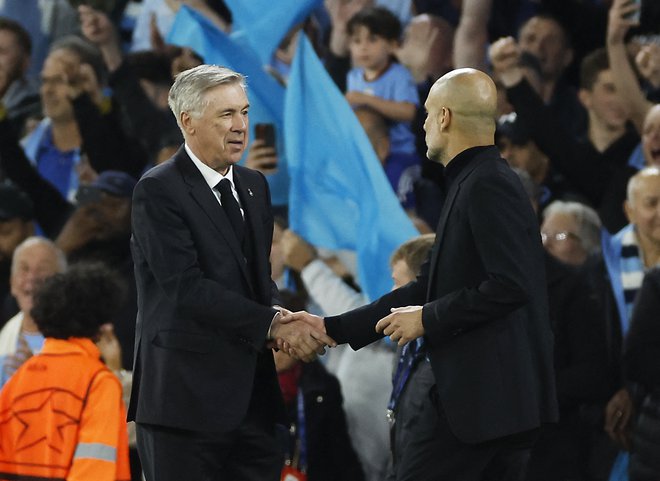 Carlo Ancelotti je ligo prvakov osvojil štirikrat, Pep Guardiola (desno) trikrat. FOTO: Jason Cairnduff/Reuters