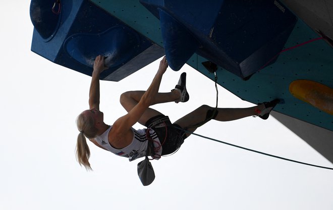 Janja Garnbret uživa v steni. FOTO: Andreas Gebert/Reuters