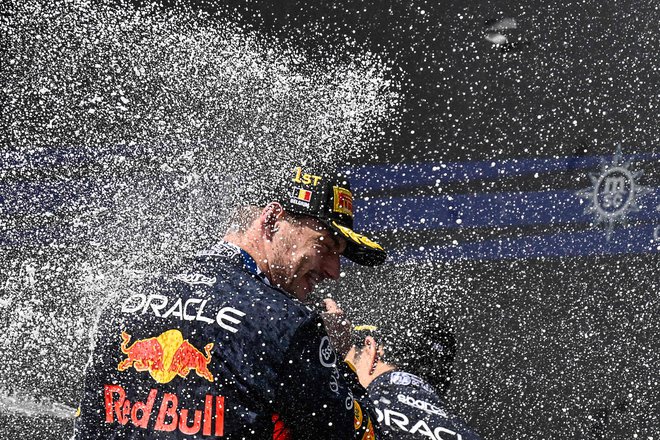 Nizozemski šampion Max Verstappen si je že tretjič zapored v Spa-Francorchampsu prislužil šampanjsko prho. FOTO: John Thys/AFP