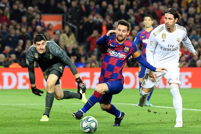 Lionel Messi in Sergio Ramos sta bila 13 let tekmeca v Španiji. FOTO: Lluis Gene/AFP