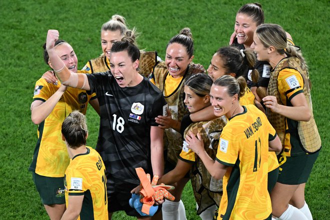 Slavje nogometašic Avstralije po napredovanju v polfinale. FOTO: William West/AFP