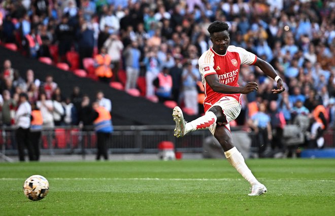 Bukayo Saka je zadel na zadnjih treh tekmah proti Unitedu, tudi v nedeljo bo prvi adut Arsenala. Foto Dylan Martinez/Reuters