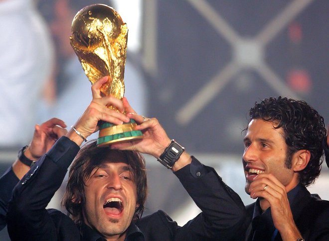 Fabio Grosso (desno, levo Andrea Pirlo) je sprejel nov izziv na klopi Lyona. FOTO: Max Rossi/Reuters