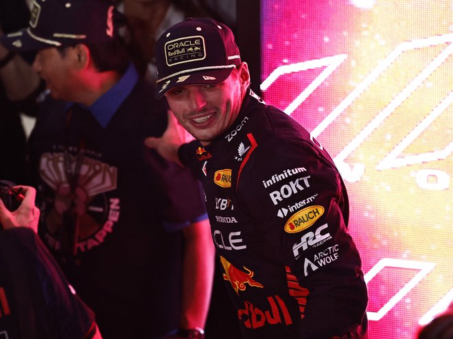 Max Verstappen je ob novi svetovni kroni ves nasmejan. FOTO: Hamad I Mohamed/Reuters
