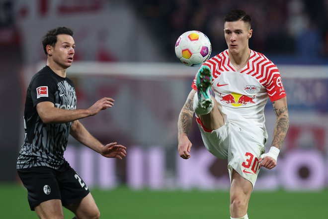 Benjamin Šeško (desno) je ogral do 63. minute. FOTO: Ronny Hartmann/AFP