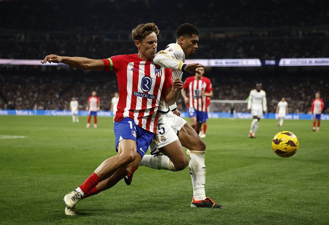 Marcos Llorente in Jude Bellingham sta si razdelila točki. FOTO: Juan Medina/Reuters